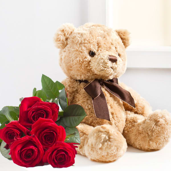 Seven red roses and Teddy Bear