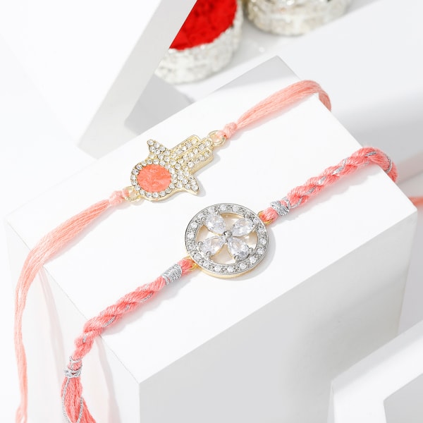 Shimmering CZ Hamsa And Flower Rakhi Set Of 2