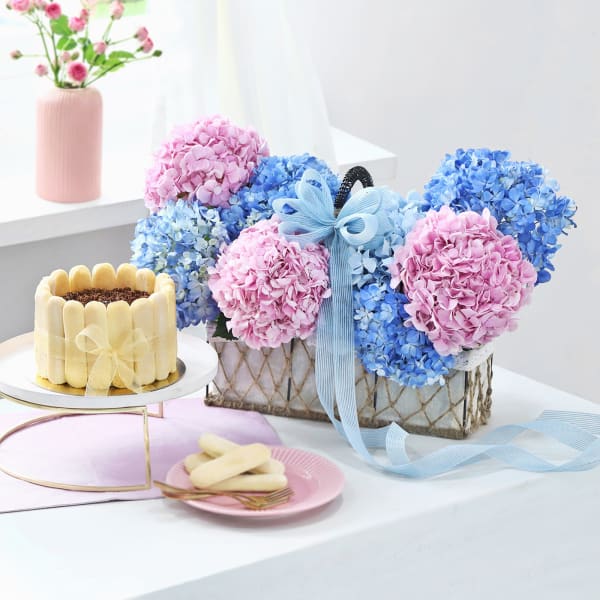 Tranquil Blooms Basket With Tiramisu Cake