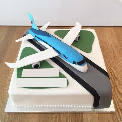 Airplane on landing strip Cake
