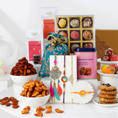 Buy/Send Elegant Family Rakhi Set And Delectable Treats Hamper Online ...