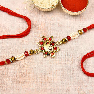 Ganesha Metallic Rakhi with Beads: Gift/Send Rakhi Gifts Online ...