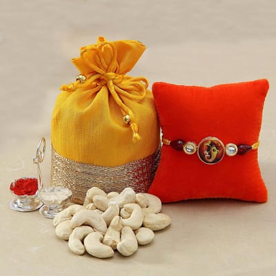 Kundan Ganesha Rakhi with Cashews in Gota Work Potli