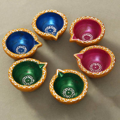 painting diyas for diwali