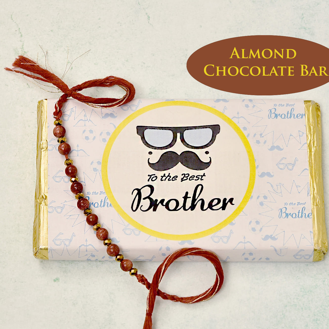 Golden & Maroon Beaded Rakhi with Yummy Chocolate Almond Bar