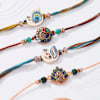 Graceful Peacock Feather Rakhis-Set Of 4